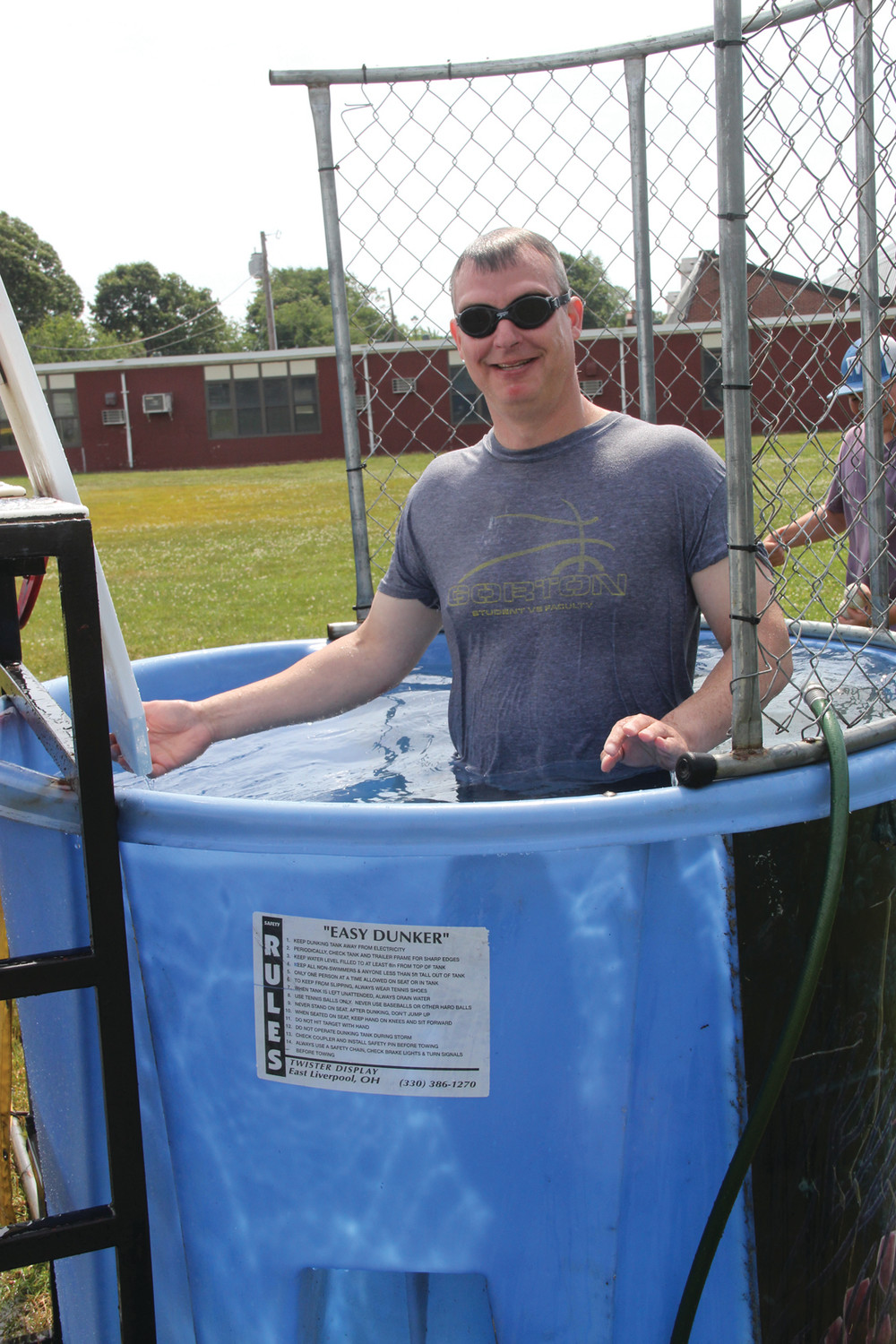 WELCOME SPLASH: Social studies teacher Peter Stone was one of eight volunteers, including the school principal, to take a turn at the dunk tank.